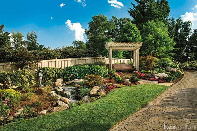 Custom wood swing overlooks a creek