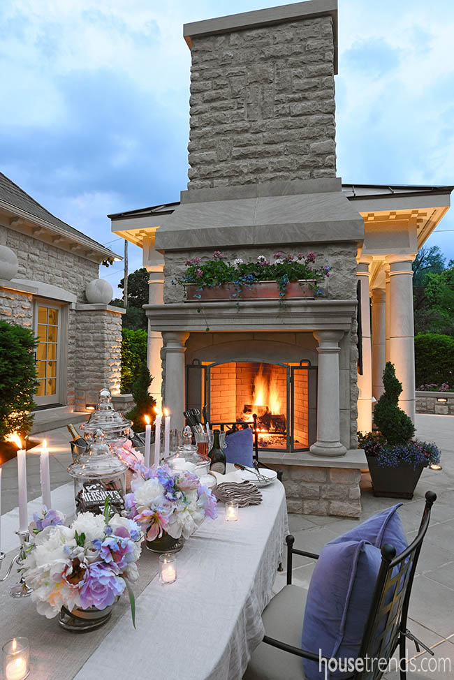 Back-to-back fireplaces heat up an outdoor dining area
