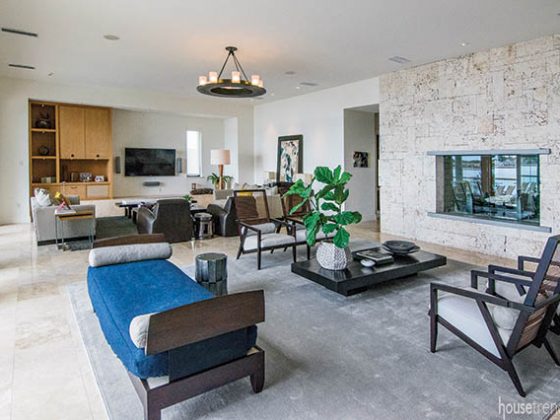 Living room centered around a stone fireplace