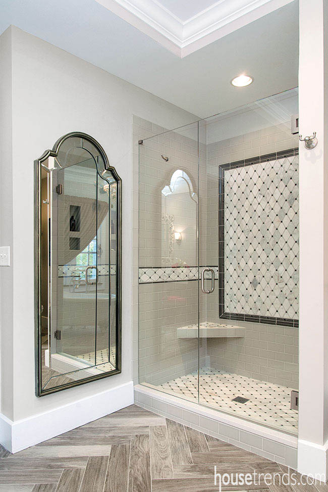 Glass shower door shows off gorgeous subway tile