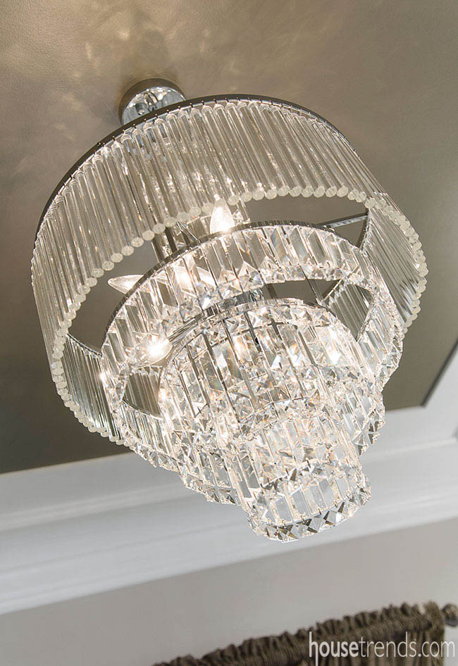 Crystal chandelier sparkles in a master bath