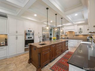 Kitchen island features a microwave drawer