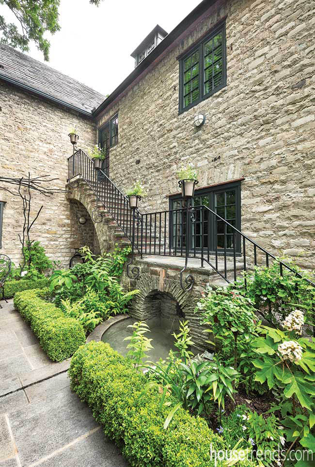 Fountain hidden beneath outdoor staircase