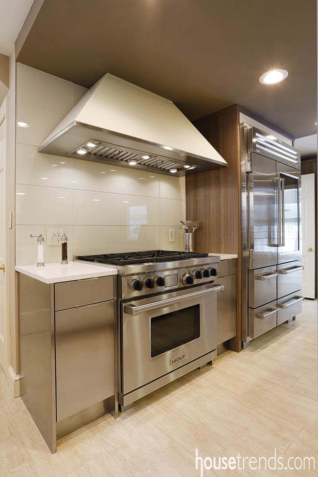 Glass backsplash complements the nearby cabinetry