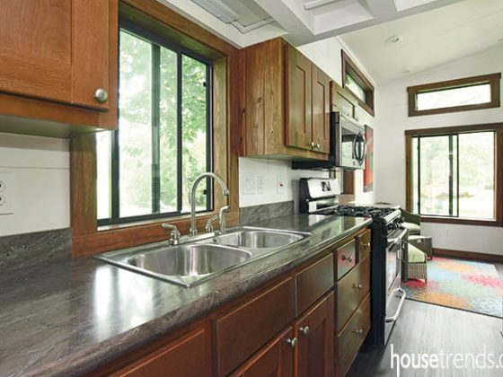 Laminate countertops and cabinetry complete a tiny kitchen