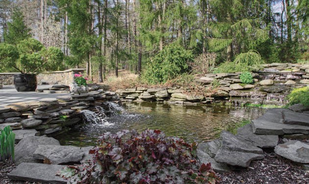 A koi pond adds to the eclectic entertaining atmosphere