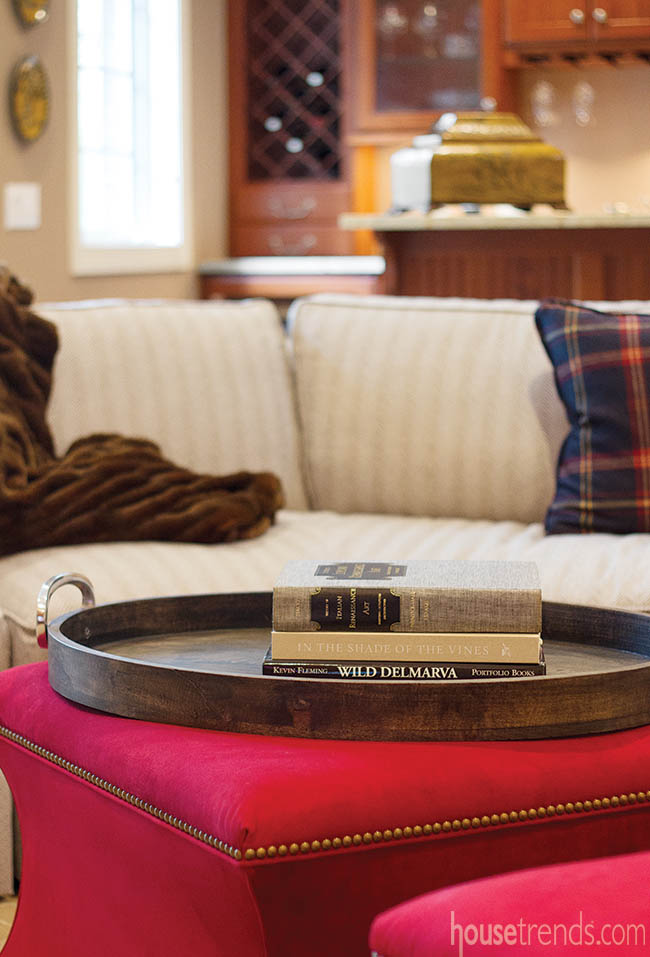 Red ottomans add fun pop of color to a basement