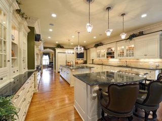 Curving countertops invite guests to sit down and relax