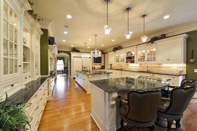 Curving countertops invite guests to sit down and relax