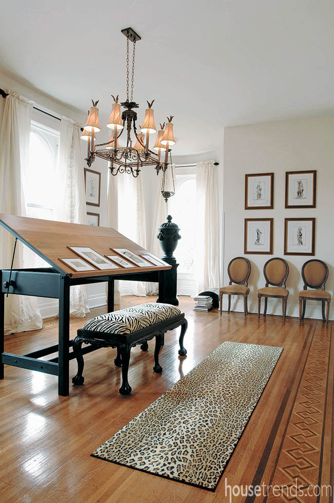 Chandelier shines on art work