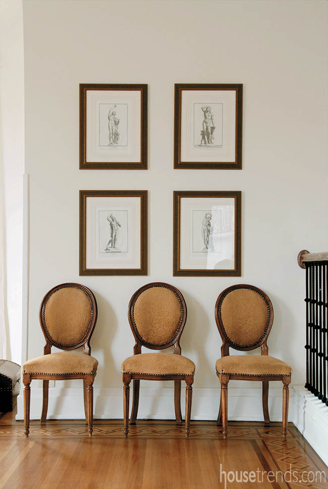 Staircase landing plays host to wall art