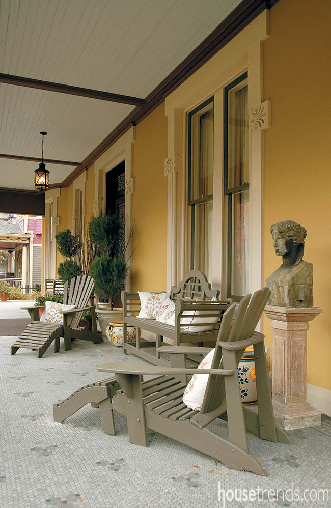 Gorgeous mosiac tile covers a wraparound porch