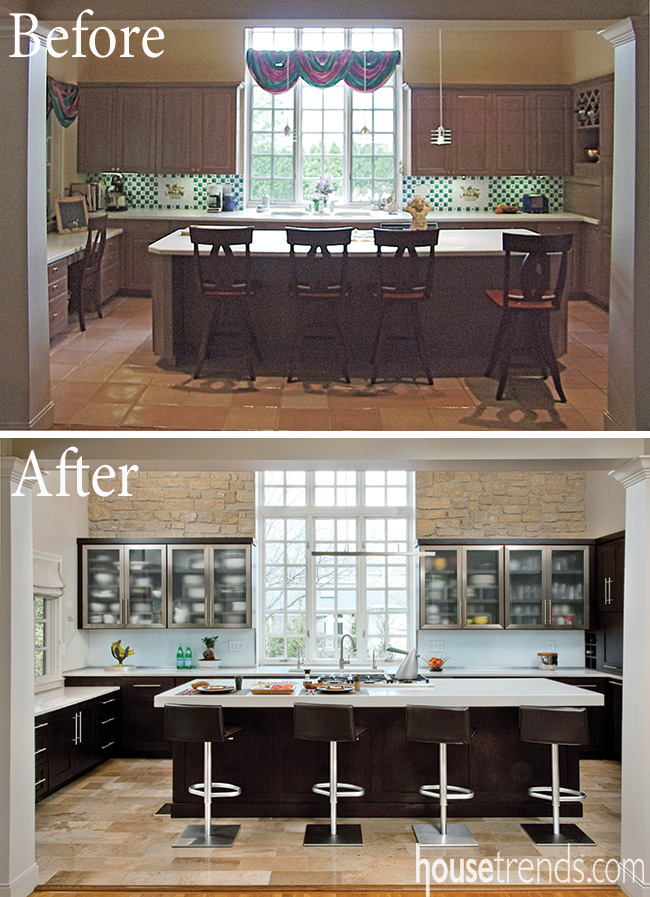 Dark cabinetry contrasts with a large window