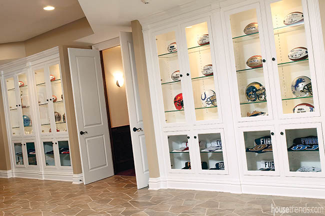 Trophy cases hold football memorabilia