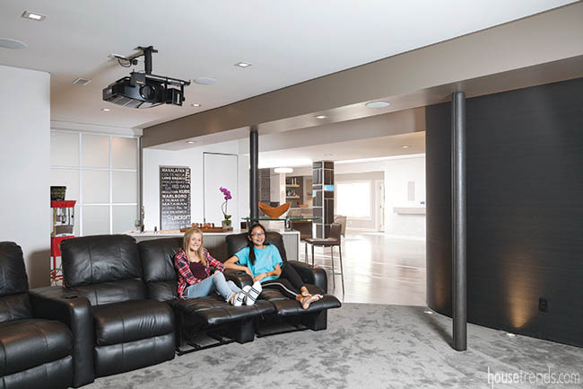 Friends gather in a home theatre