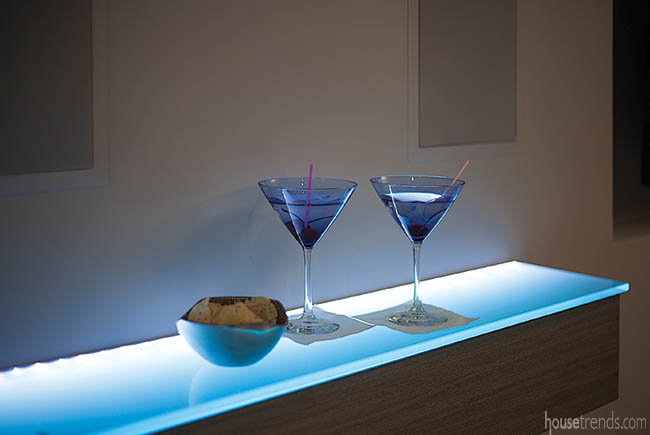 Convenient floating shelves surround a dance floor