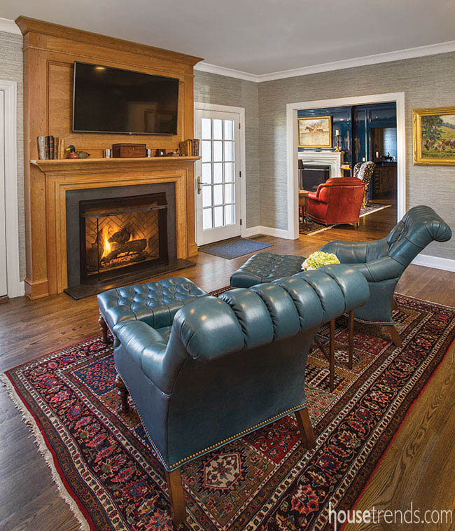 Fireplace surround pops in a casual gathering space