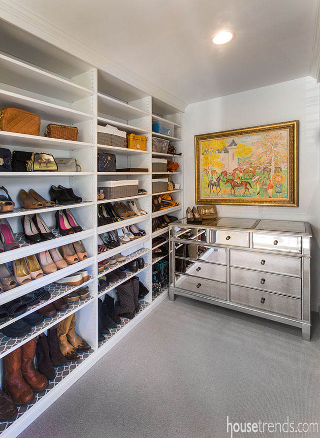 Mirrored cabinet fronts dazzle in a walk-in closet