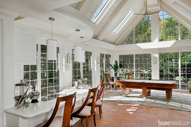 Windows shine light on an unconventional game room design