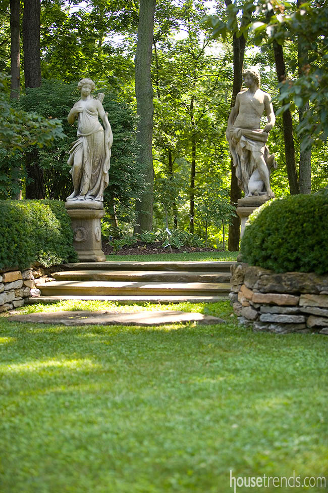 Statues add interest to a back yard