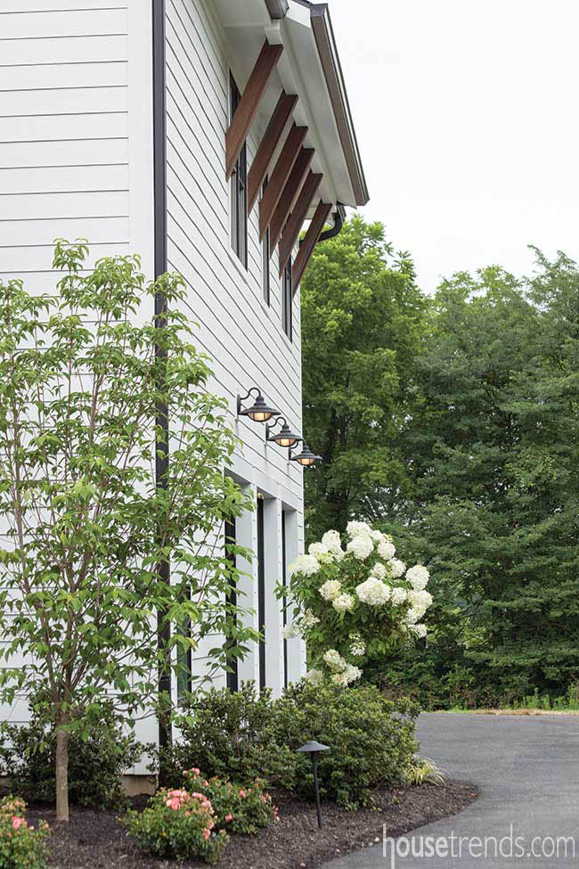 Gooseneck lamps above garage doors