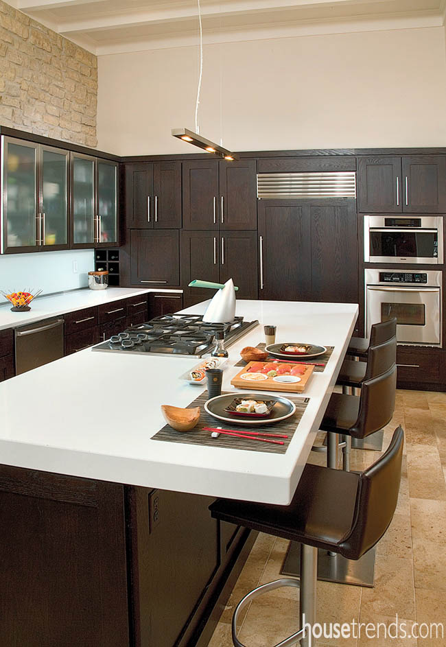 White countertop contrasts with dark cabinetry