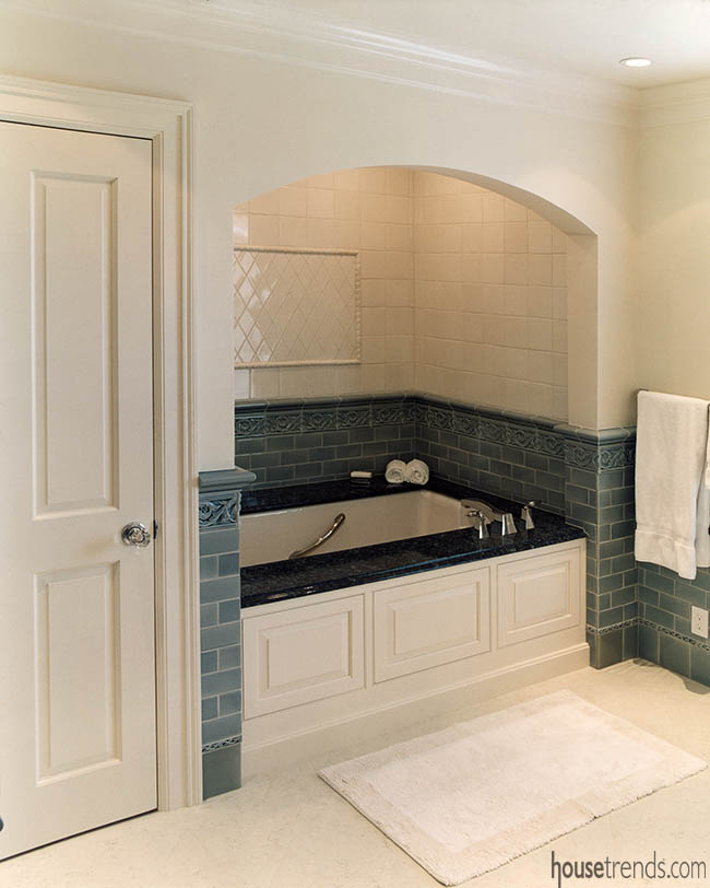 Blue tile embellishes a bath tub design