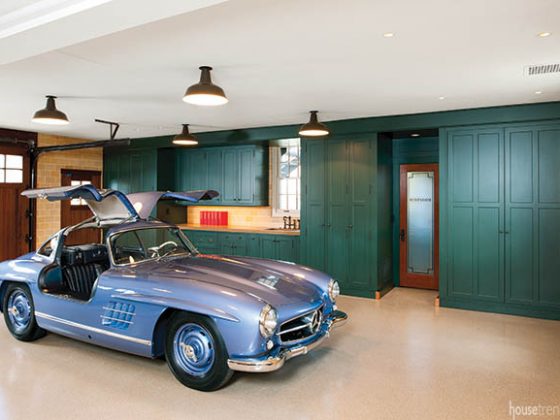 Green built-in cabinets keep a garage tidy