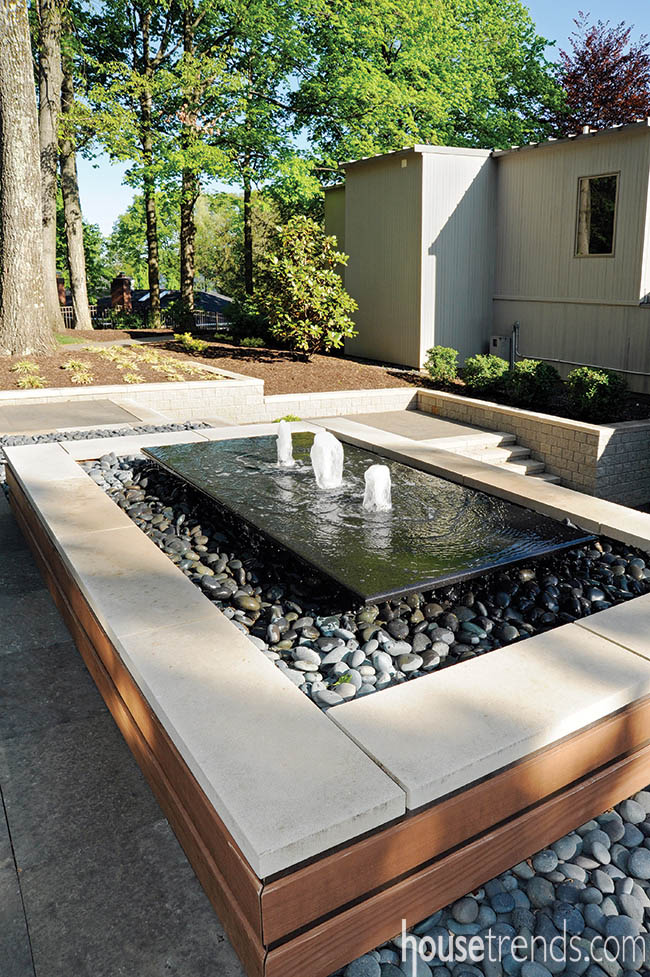 Wood allows an outdoor water fountain to stand out