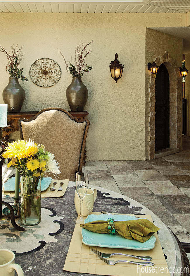 Arched doorway adds romance to an outdoor dining area