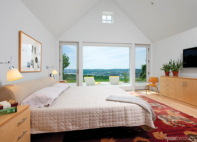 Area rug adds color to a master bedroom