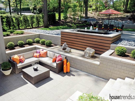 Colorful throw pillows pop on a stone patio