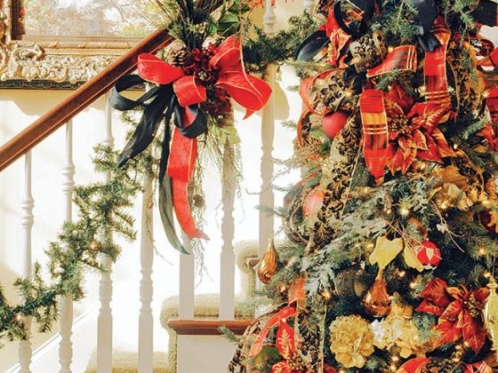 Christmas tree greets guests in an entry hall