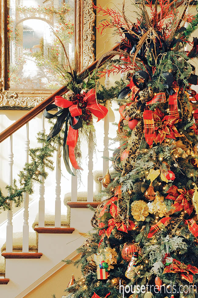 Christmas tree greets guests in an entry hall