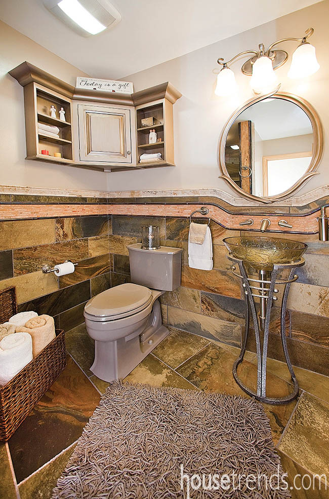 Tiles and stones work to create a welcoming guest bath