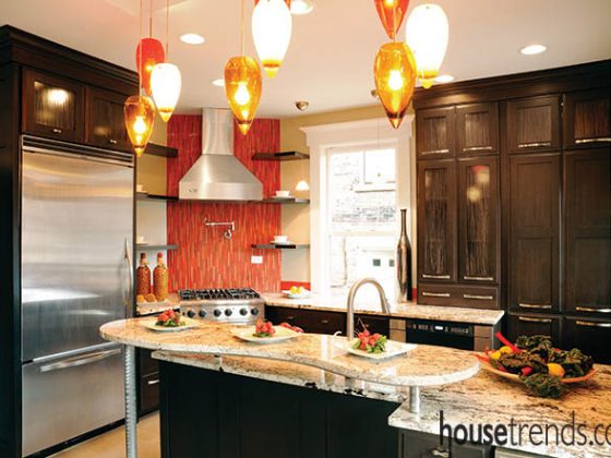 Lighting and cabinetry complement a kitchen design