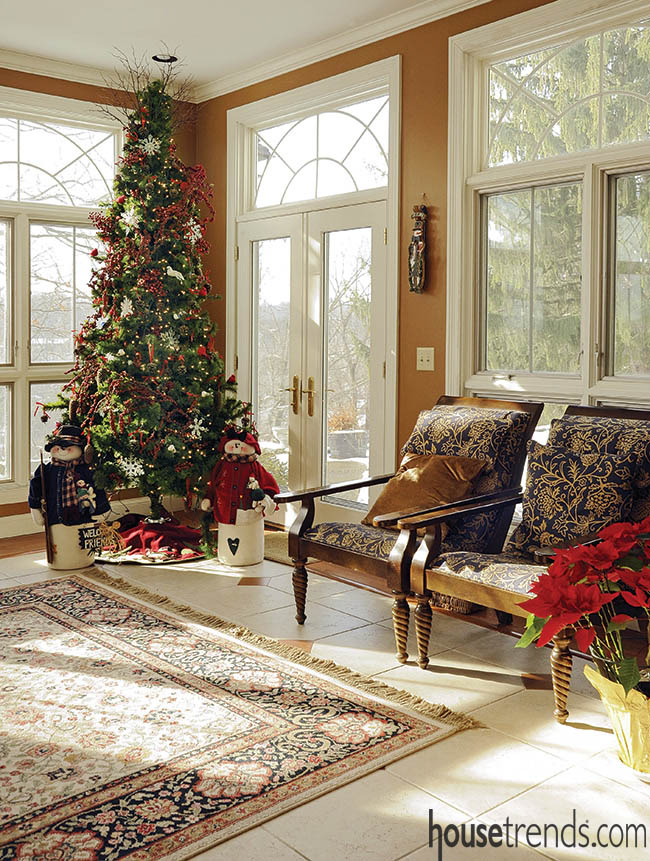 Christmas tree stands tall in a family room