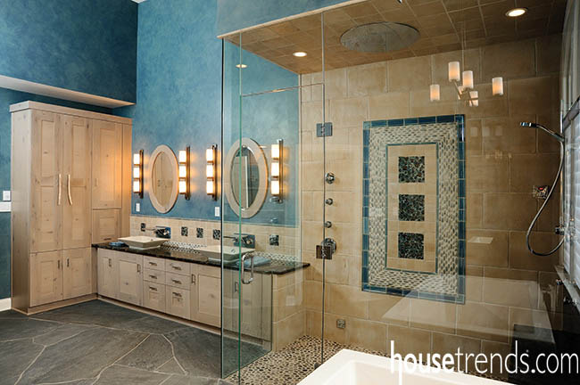 Blue walls complement everything in this bathroom design