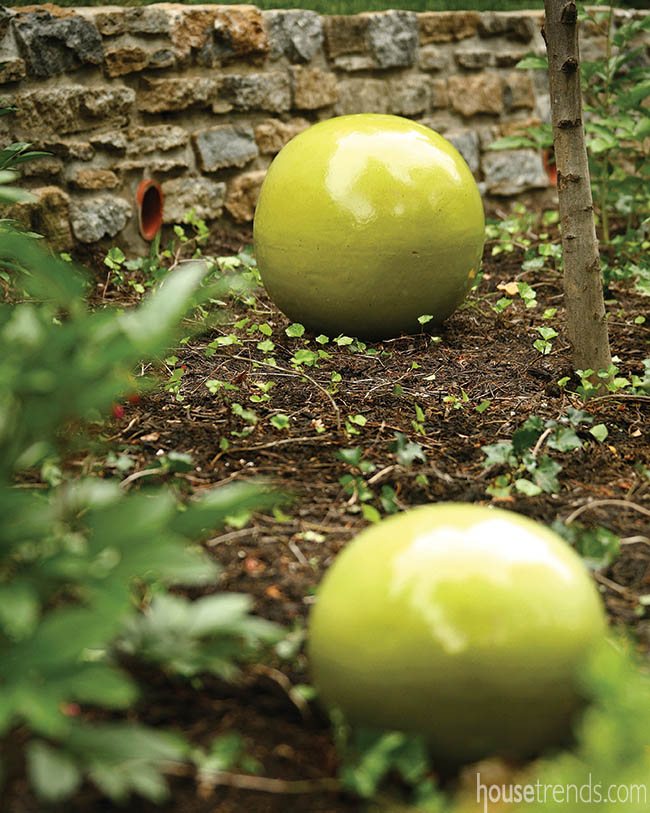 Green spheres add interest to a landscape