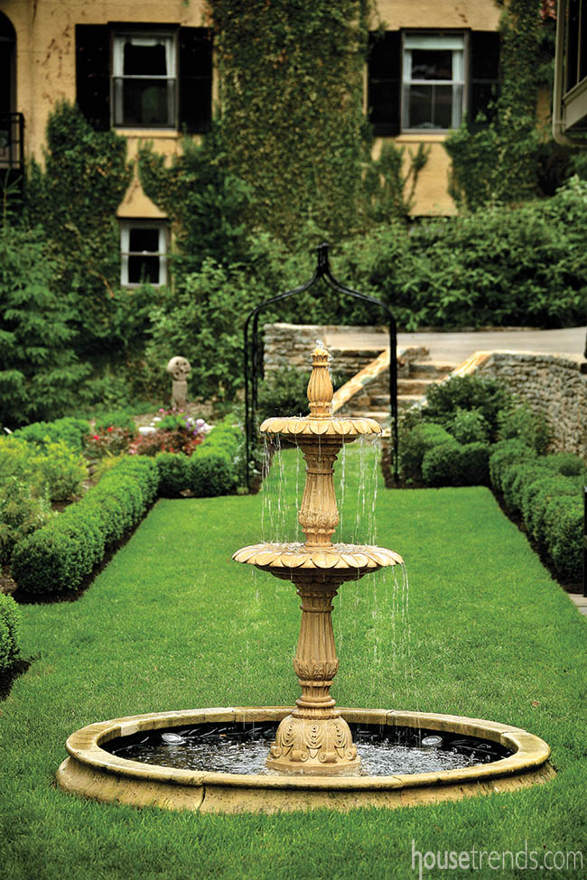 English garden with an elegant water fountain