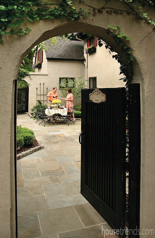 Charming gate ushers guests into a courtyard