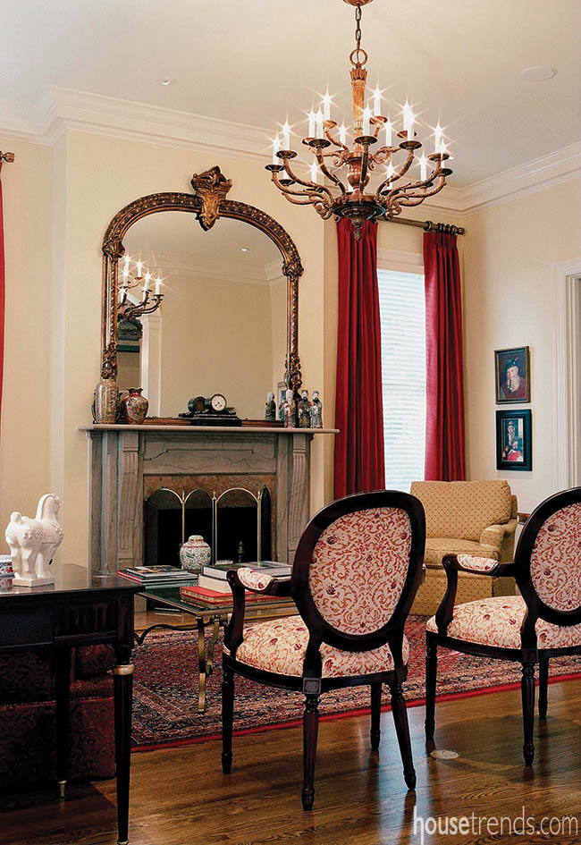 Antique mirror reflects the elegance of a formal living room