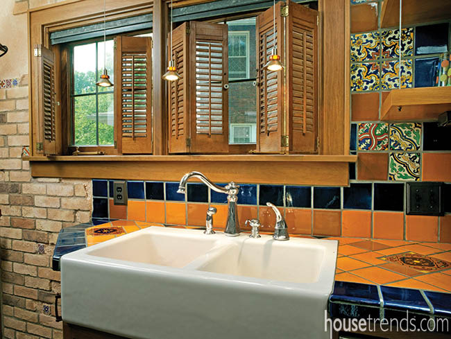Wooden shutters flank kitchen windows