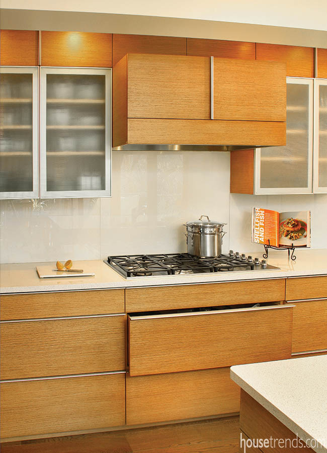 Custom range hood blends with kitchen cabinetry