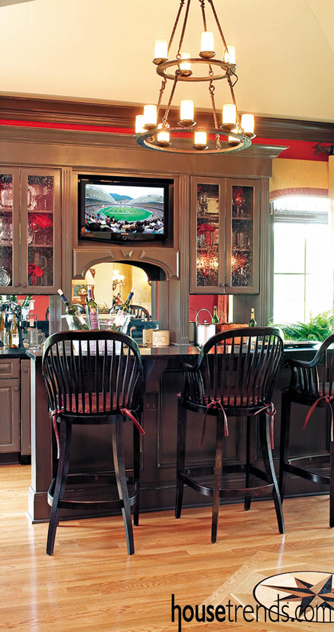 Chandelier lends interest to a bar design