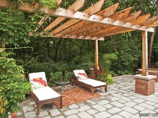 Slatted pergola shades a pair of lounge chairs