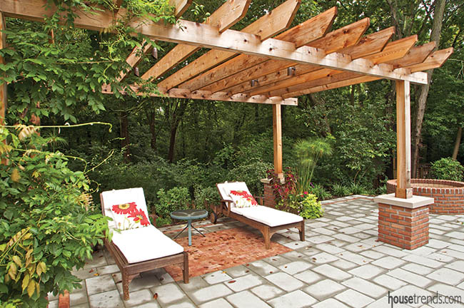 Slatted pergola shades a pair of lounge chairs