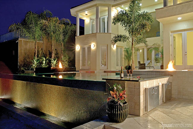 Outdoor lighting adds drama to a back yard