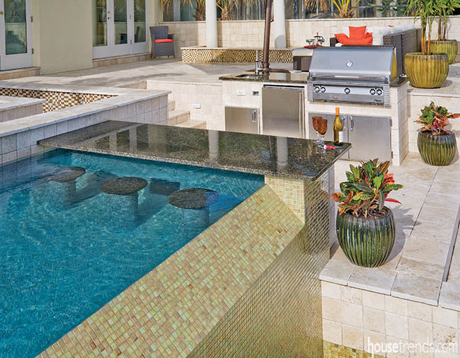 Swimming pool with a swim-up bar