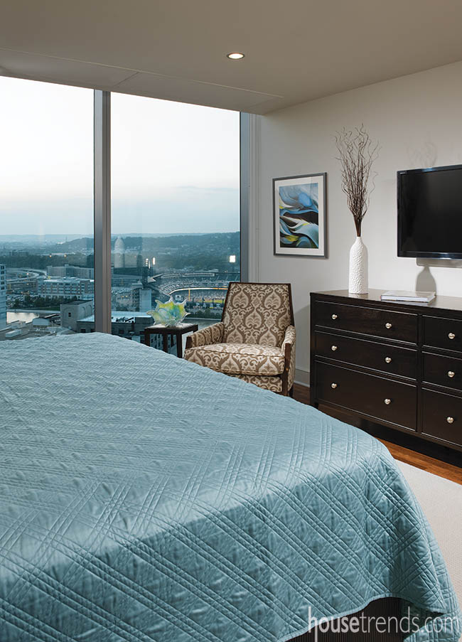 Floor-to-ceiling windows in a master bedroom